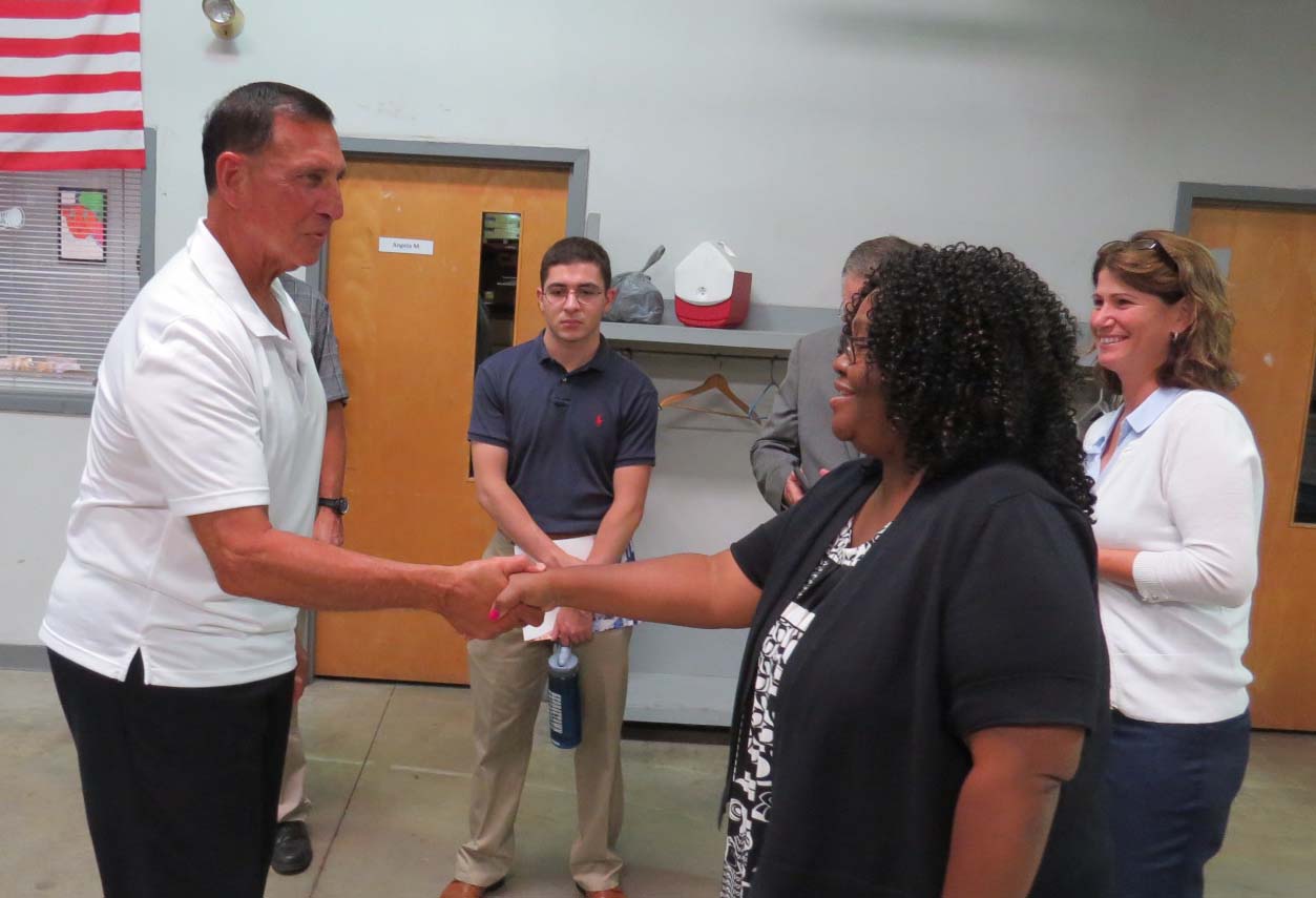 Congressman LoBiondo shaking hands with Easterseals New Jersey Staff name is Felita Johnson, Associate Director of Employment Services; Shirley Battistini.
